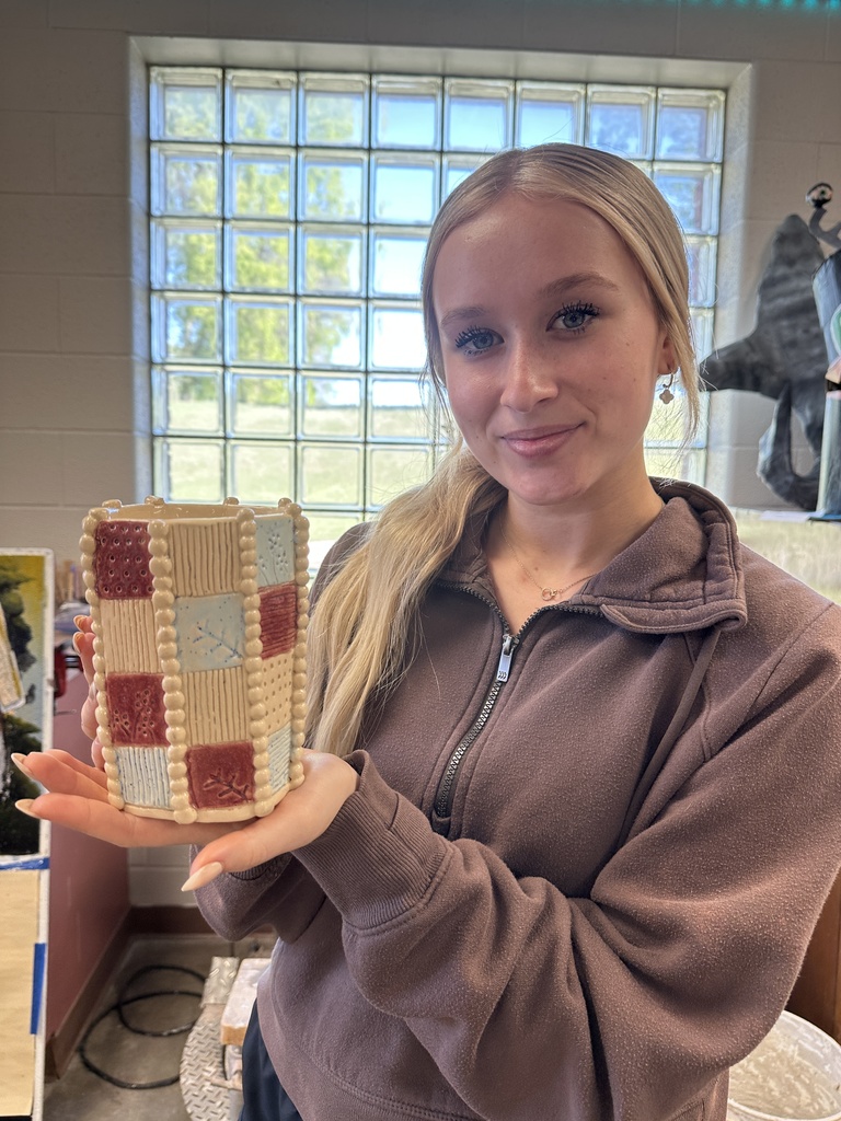 student showcaing art