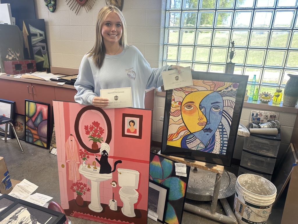 student showcaing art