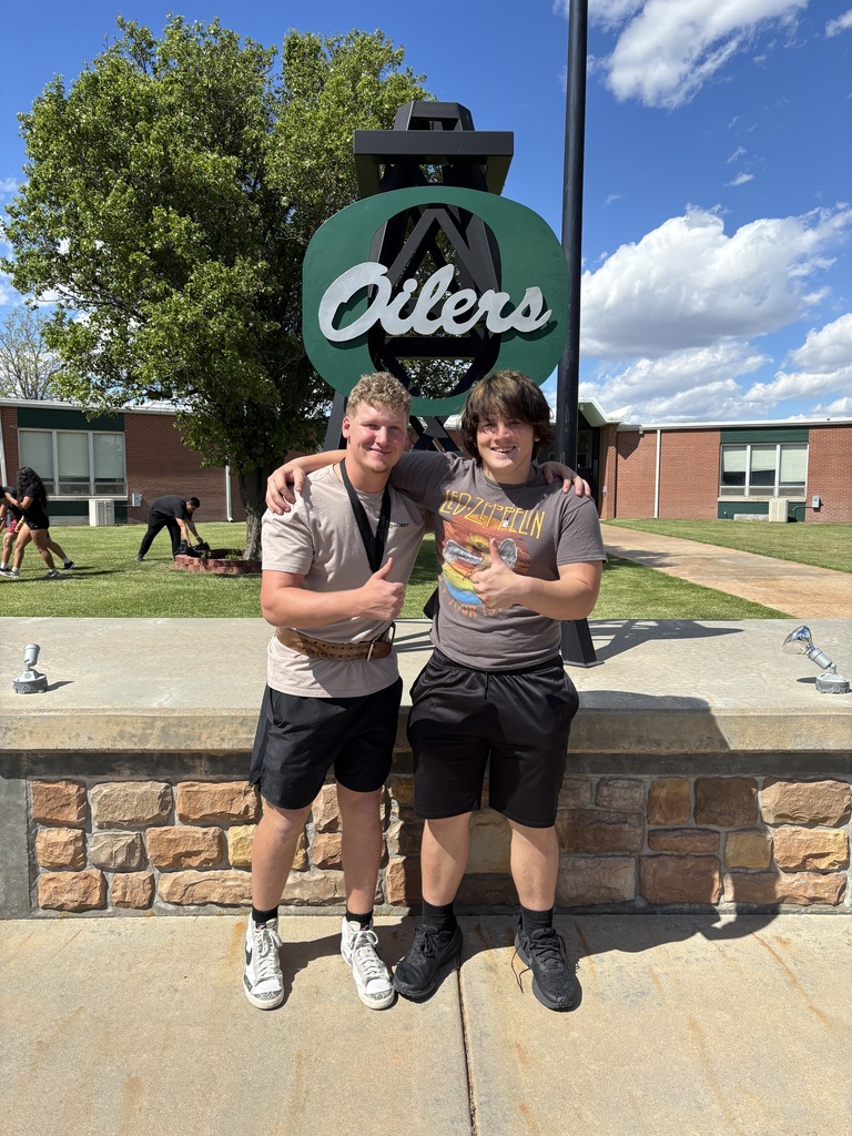 Matt and Aidyn smiling  at camera with thumbs up