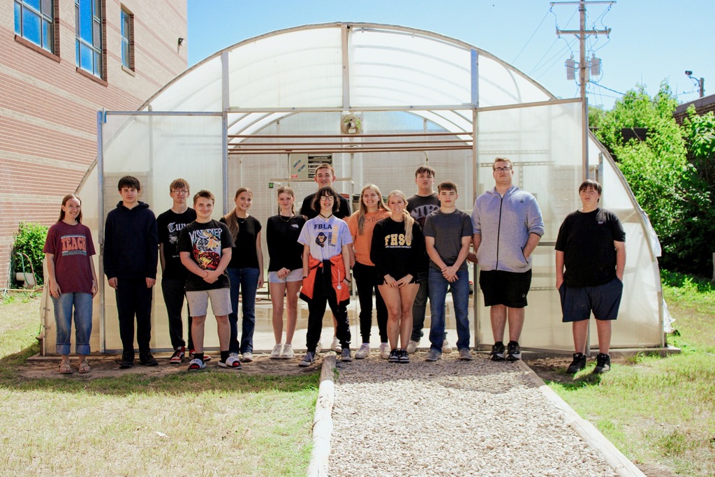 Group photo of the SHS Horticulture class in front of the renovated greenhouse