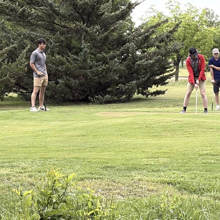 Seth watching Cooper putt