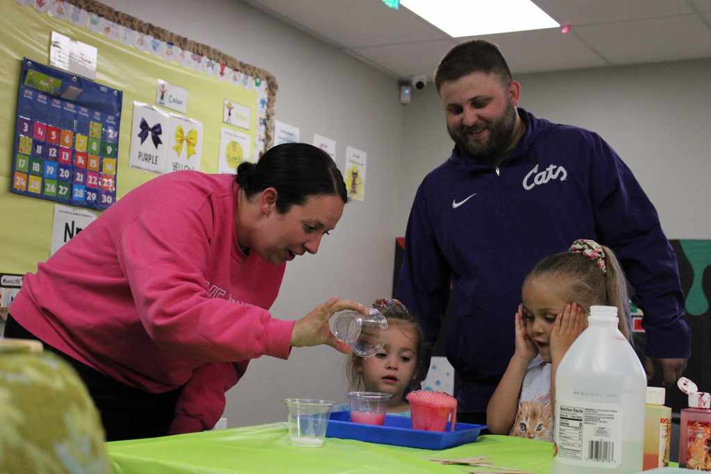 family of four engaging in a stem project