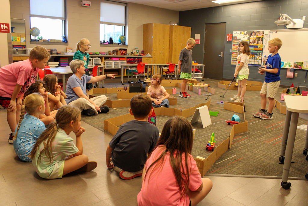 kindergarten class discussing a mini-golf course