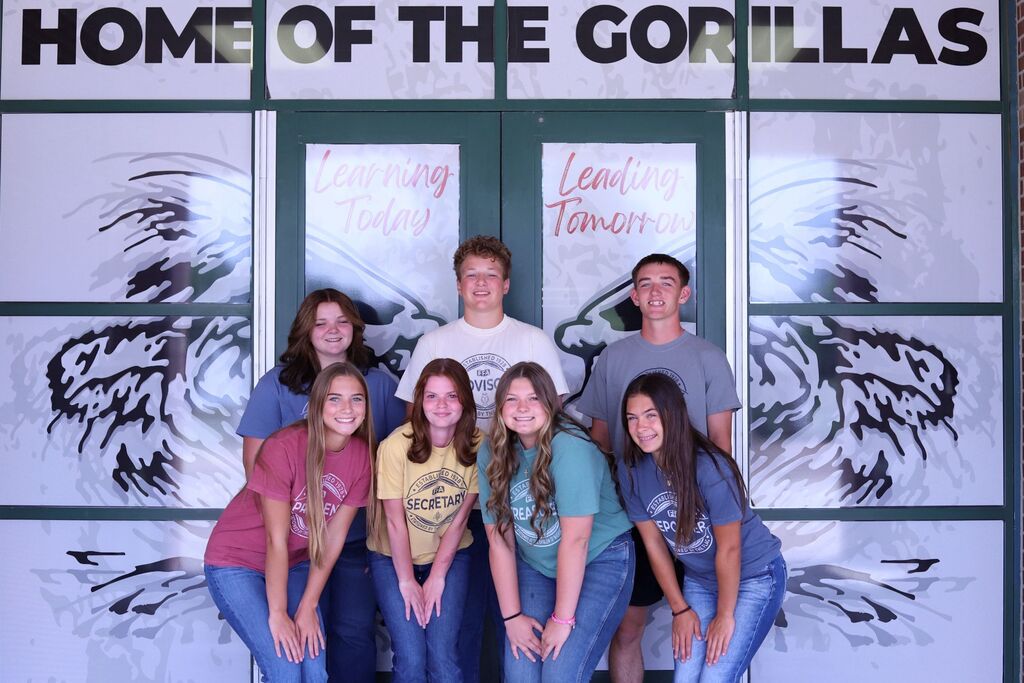 The Solomon FFA officers posing as a group in front of the entry doors to the school