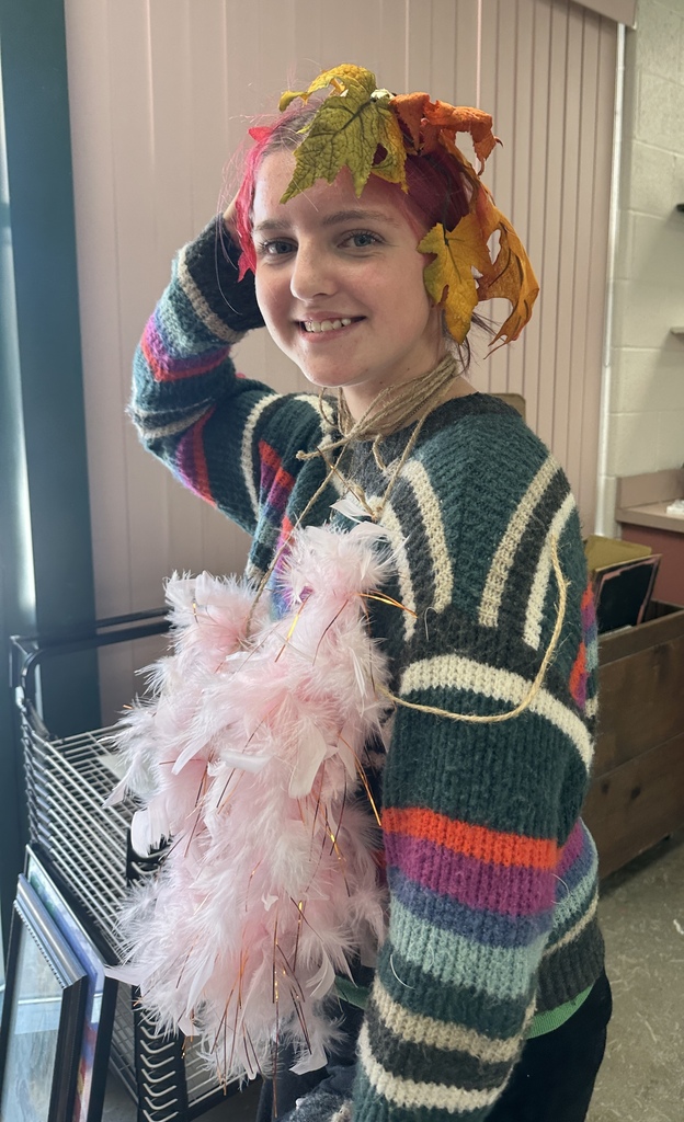 student showing off their handmade headpiece designs