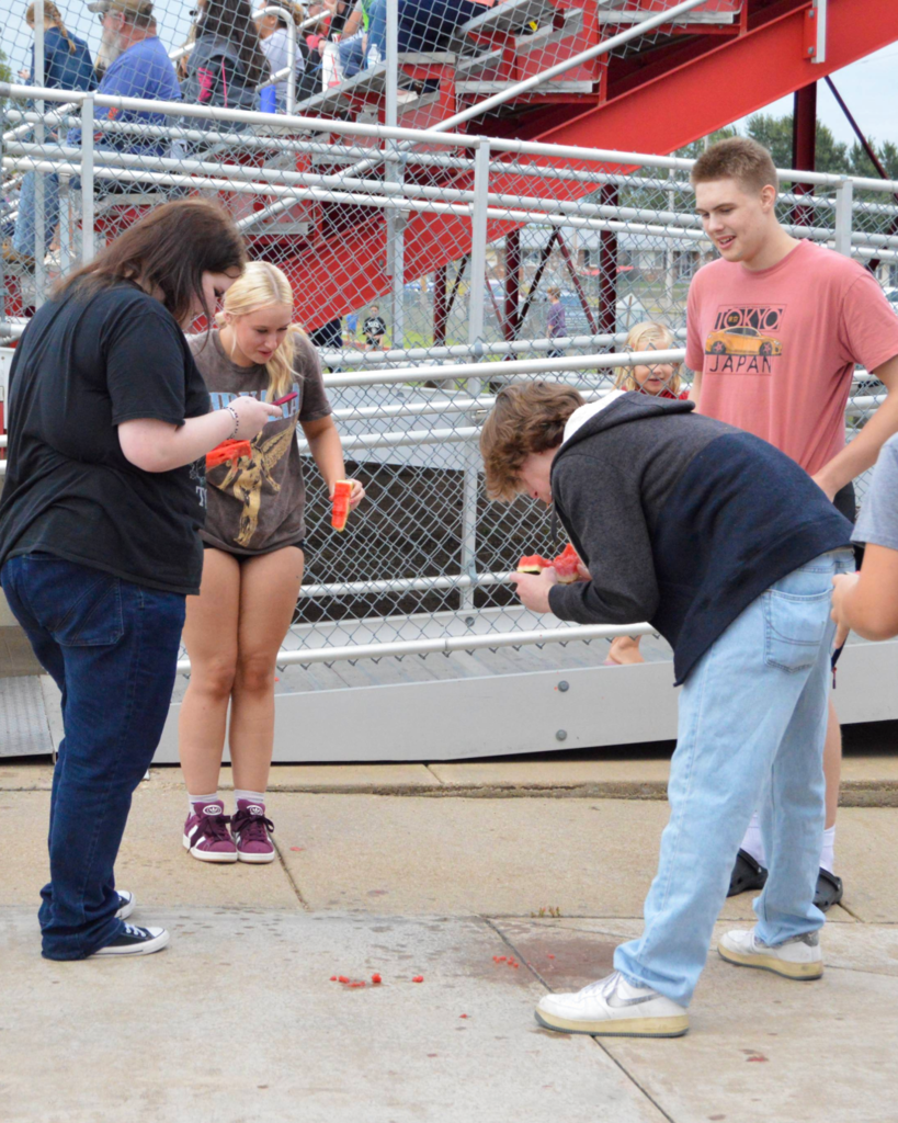 2026 seniors enjoying their watermelon while getting very messy