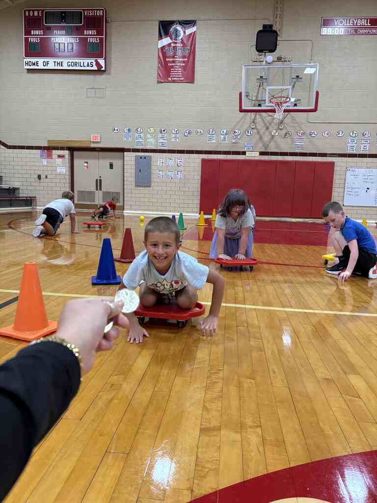 students having fun on scooters in pe