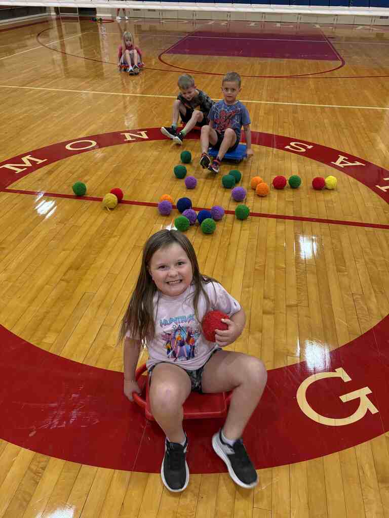 students having fun with scooters in pe