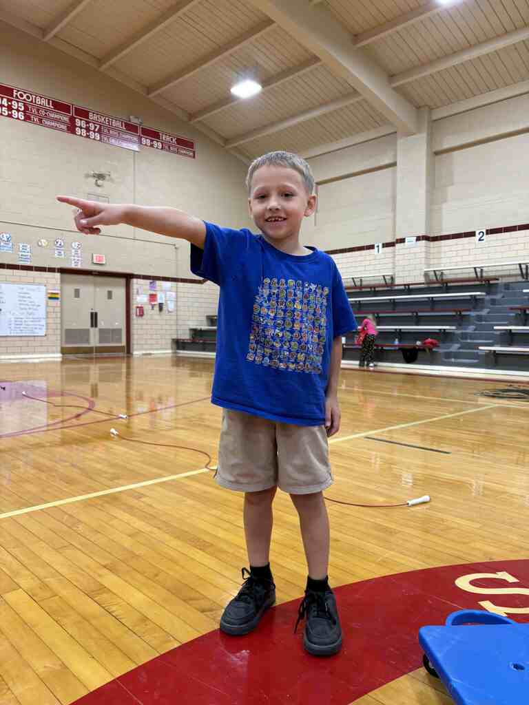 student pointing to the left