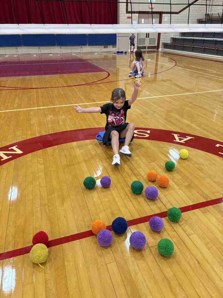 students having fun on scooters in pe