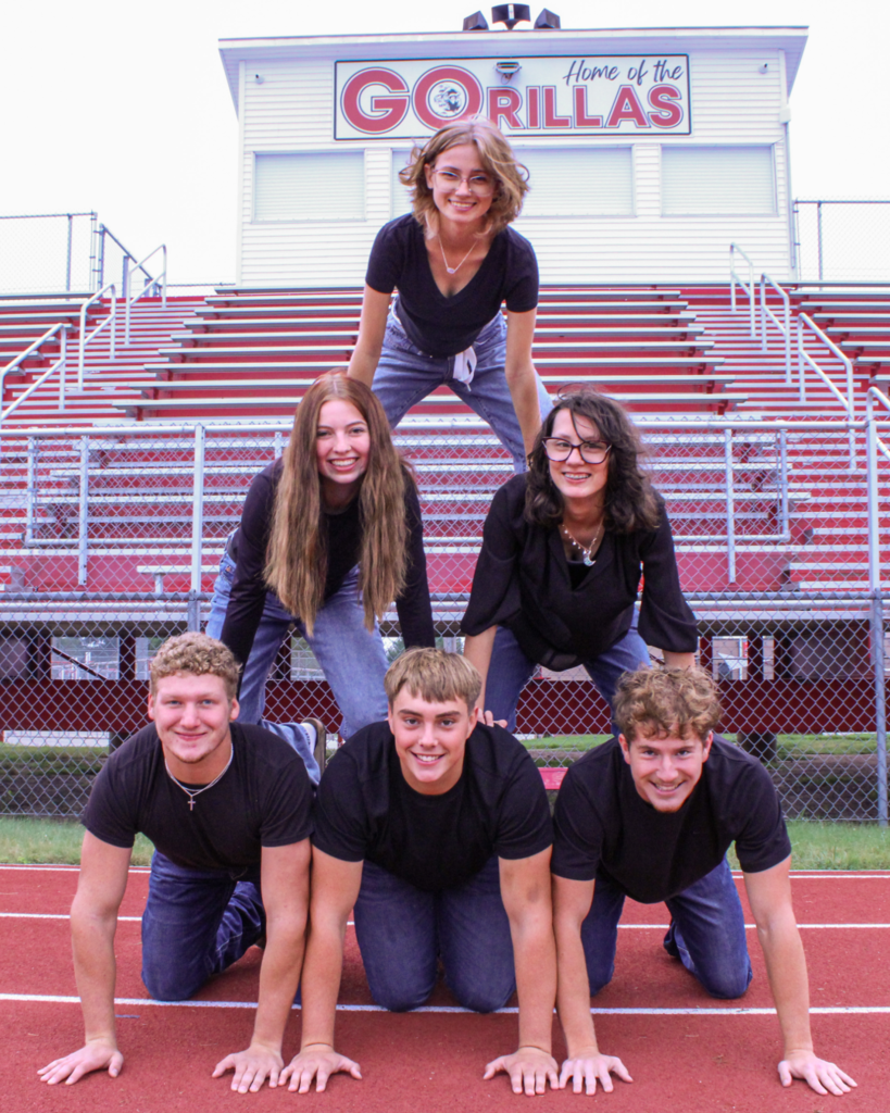 homecoming candidates situated in a human pyramid