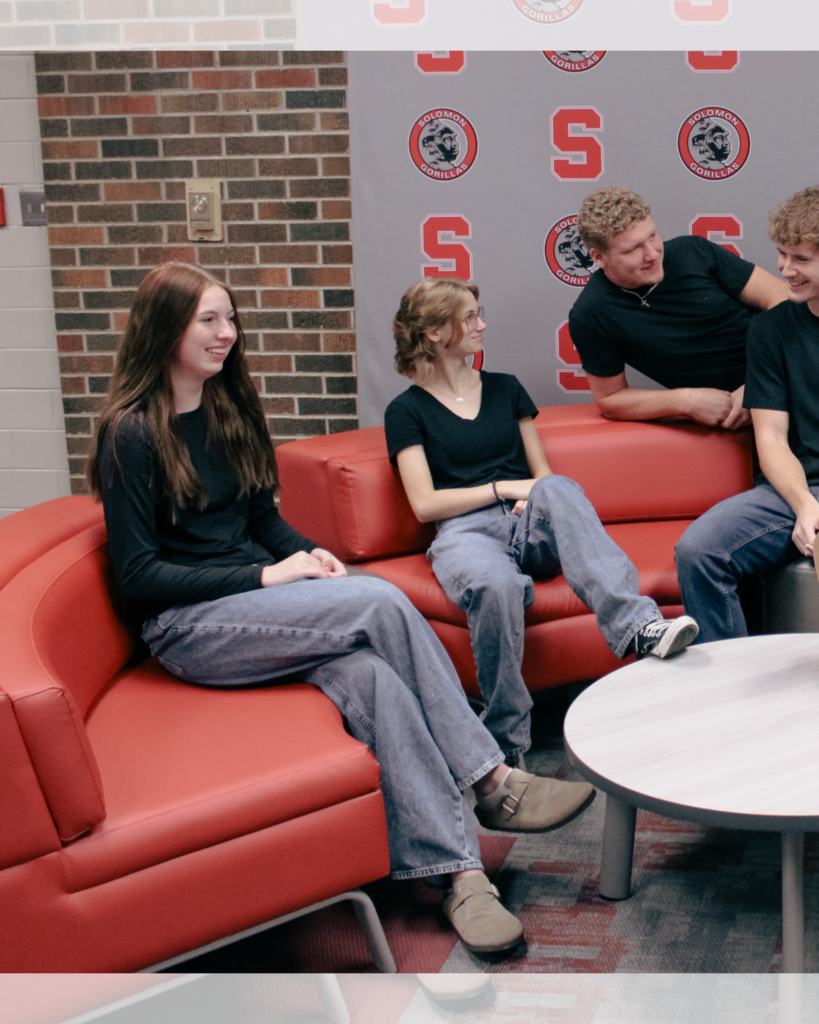 half of a group photo featuring four students