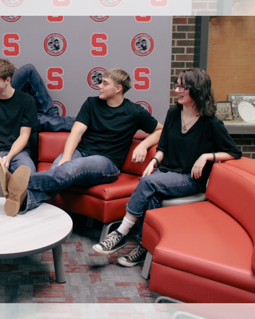 half of a group photo featuring two students