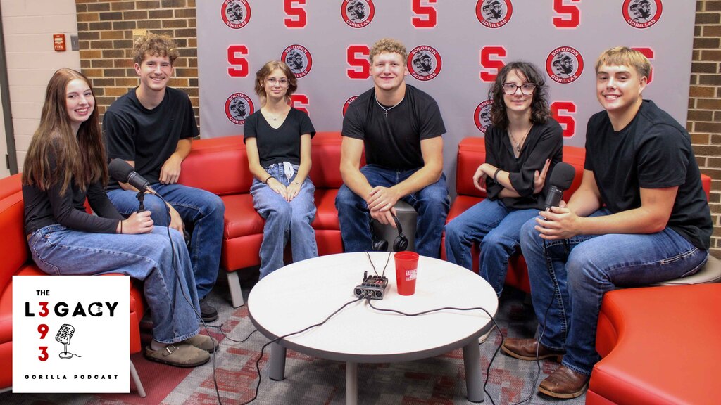 Fall 2026 Homecoming candidates sitting on the classic red couch for their podcast