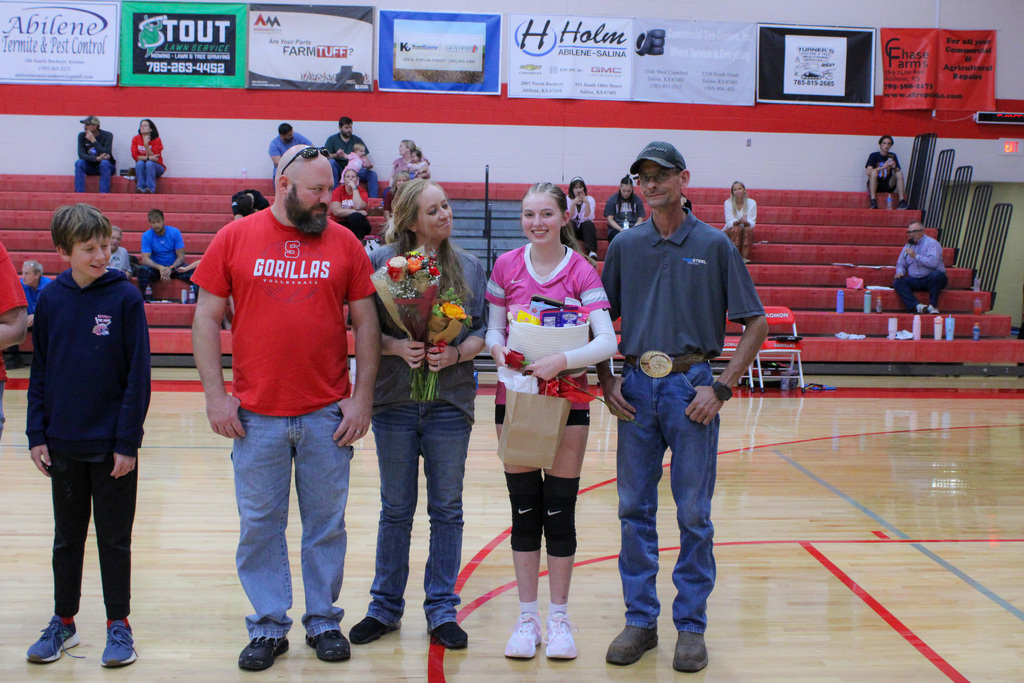 student, Zoey, and her family on volleyball senior night