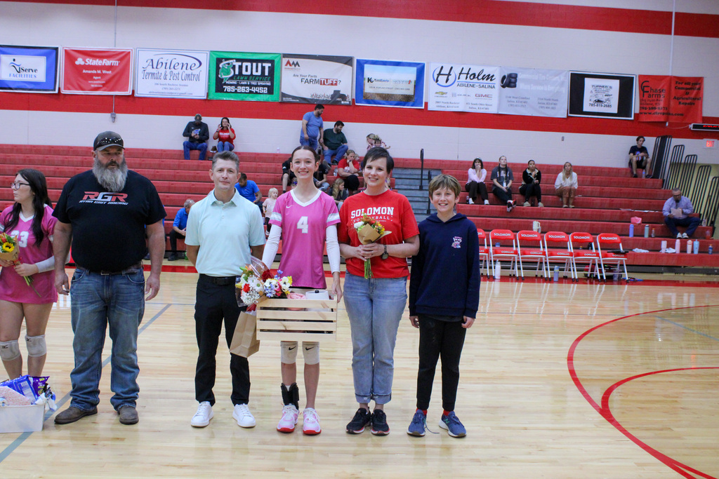 Student, Etel and her family on volleyball senior night