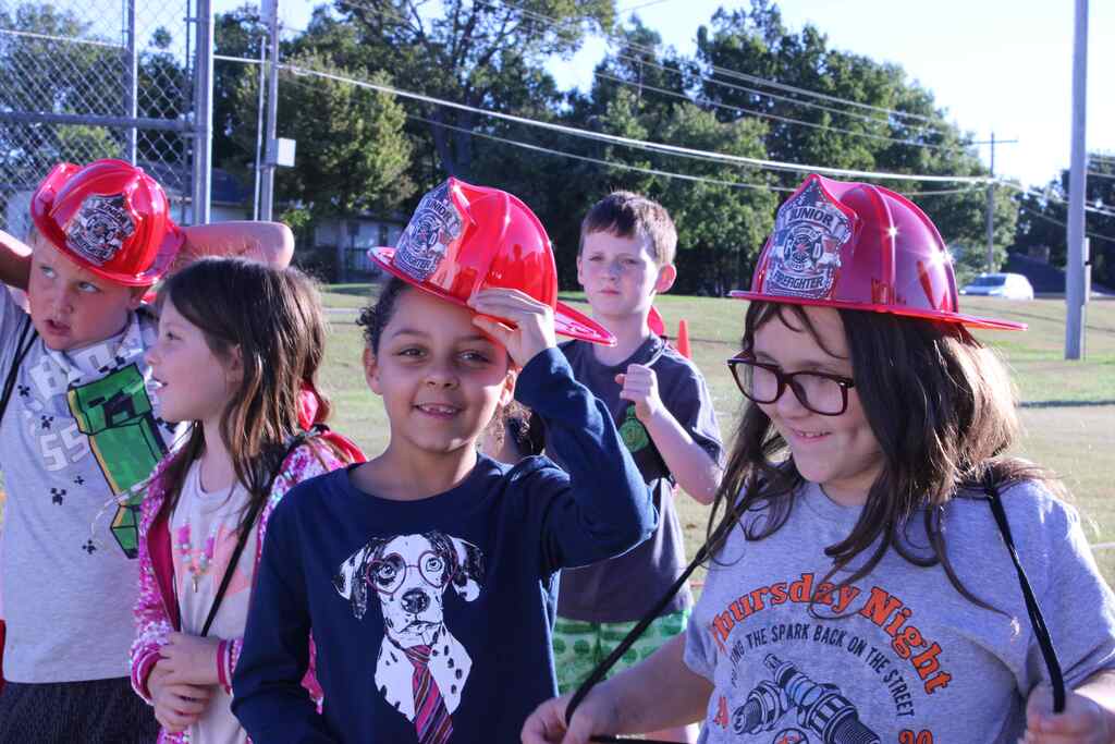 group of students wearing their fire safety hats