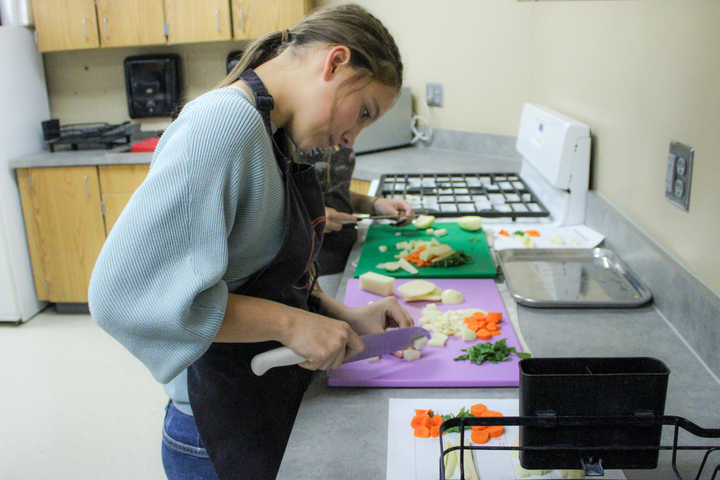 students practicing their cutting skills