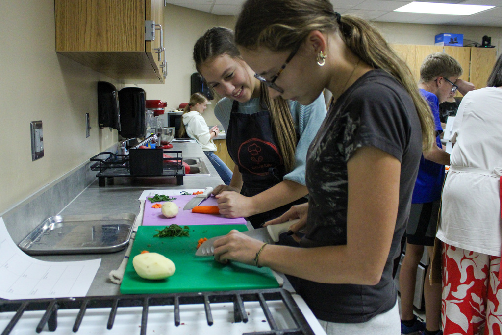 students practicing their cutting skills