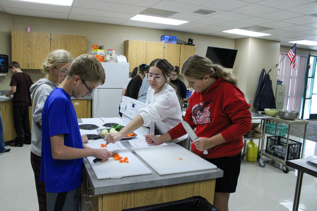 students practicing their cutting skills