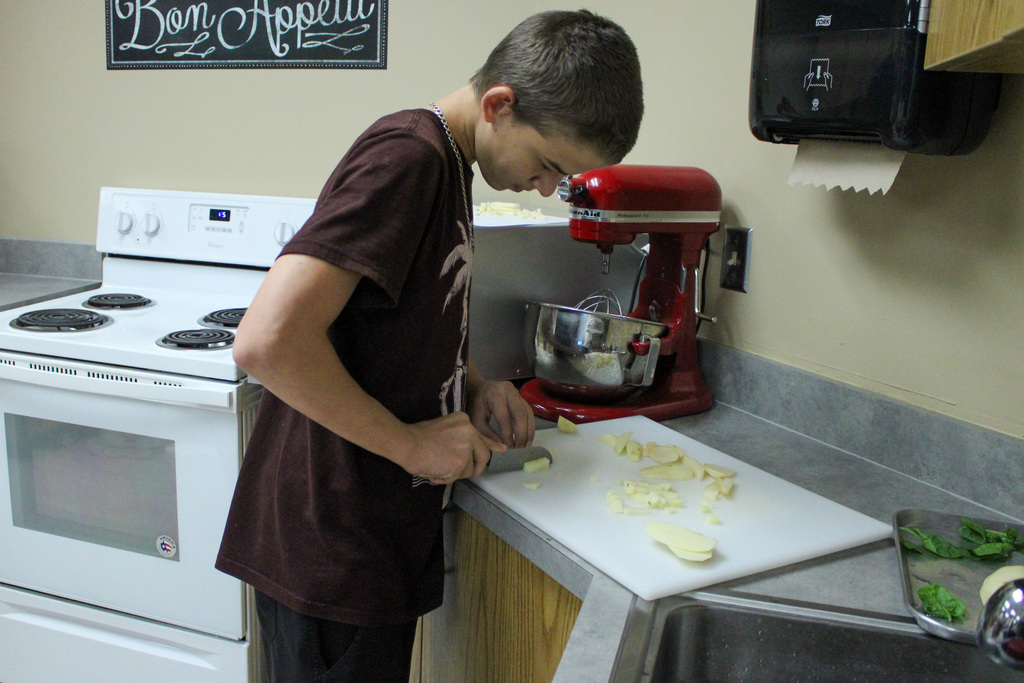students practicing their cutting skills