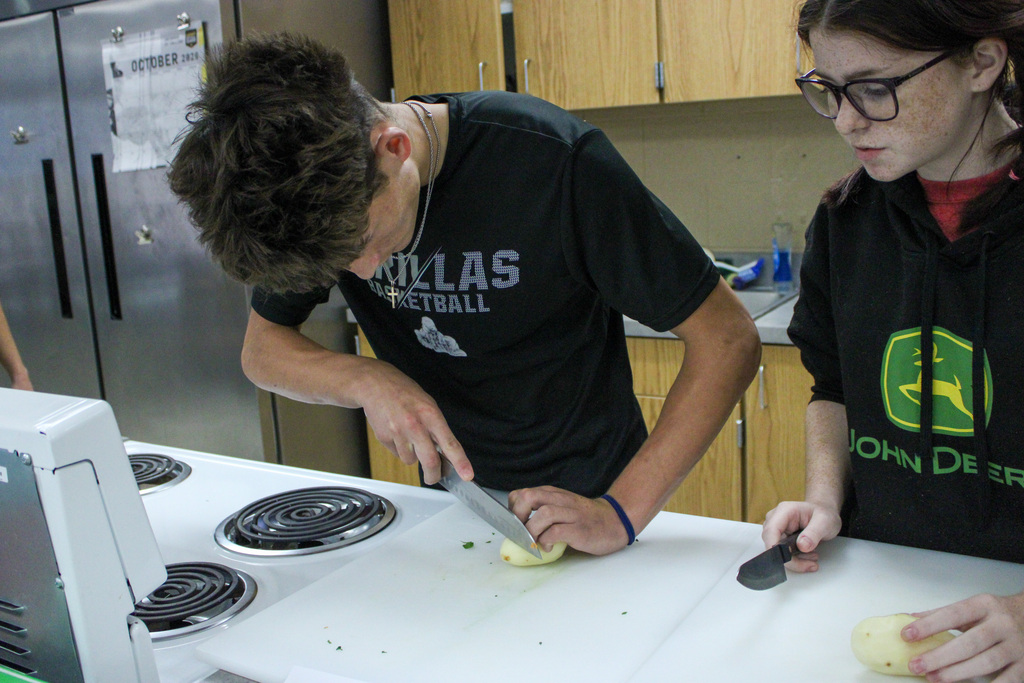 students practicing their cutting skills