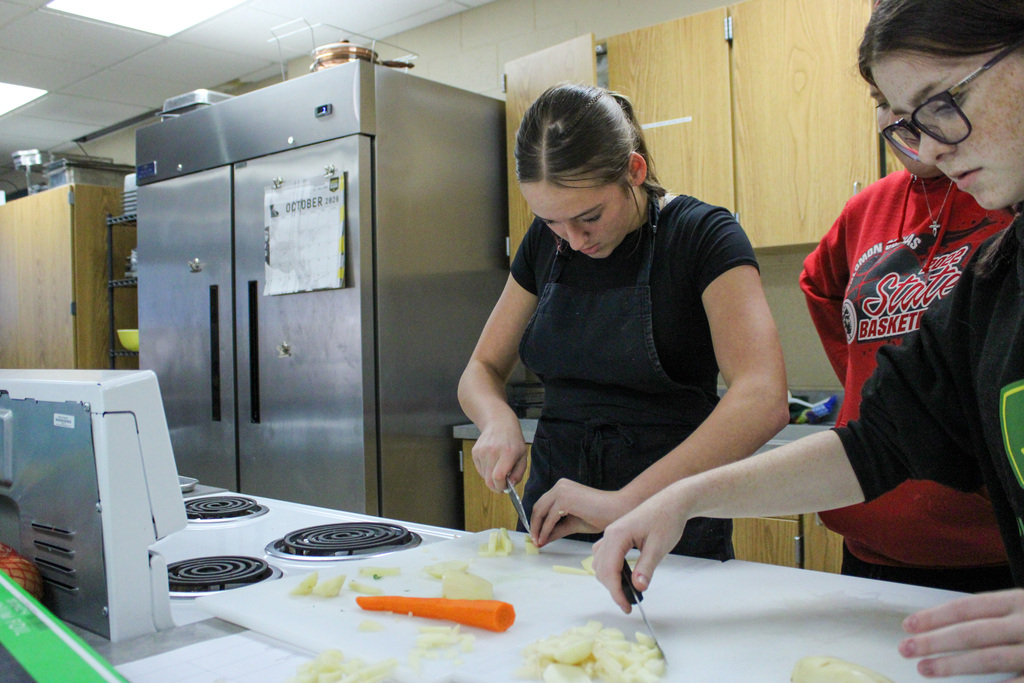 students practicing their cutting skills