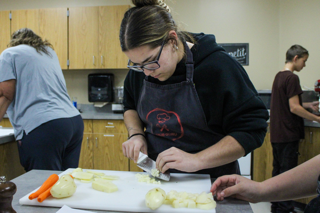 students practicing their cutting skills