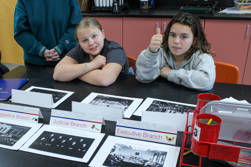 student reviewing Eisenhauer materials during presentation