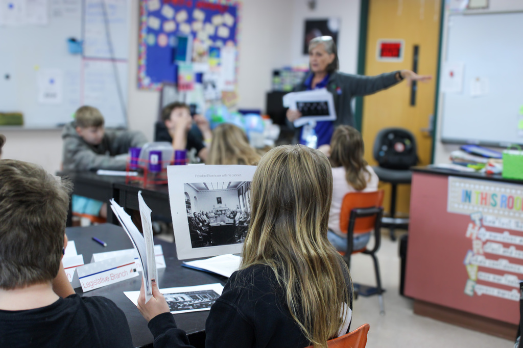 student reviewing Eisenhauer materials during presentation