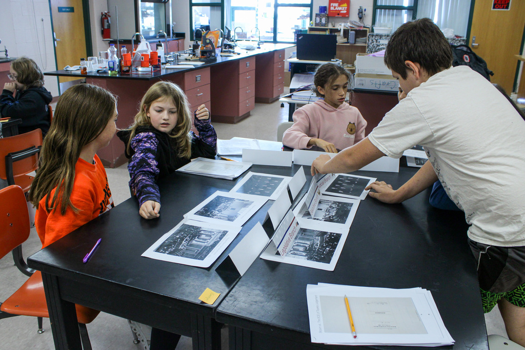 students reviewing Eisenhauer materials during presentation