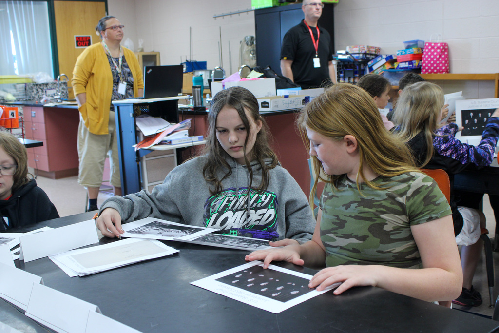 students reviewing Eisenhauer materials during presentation