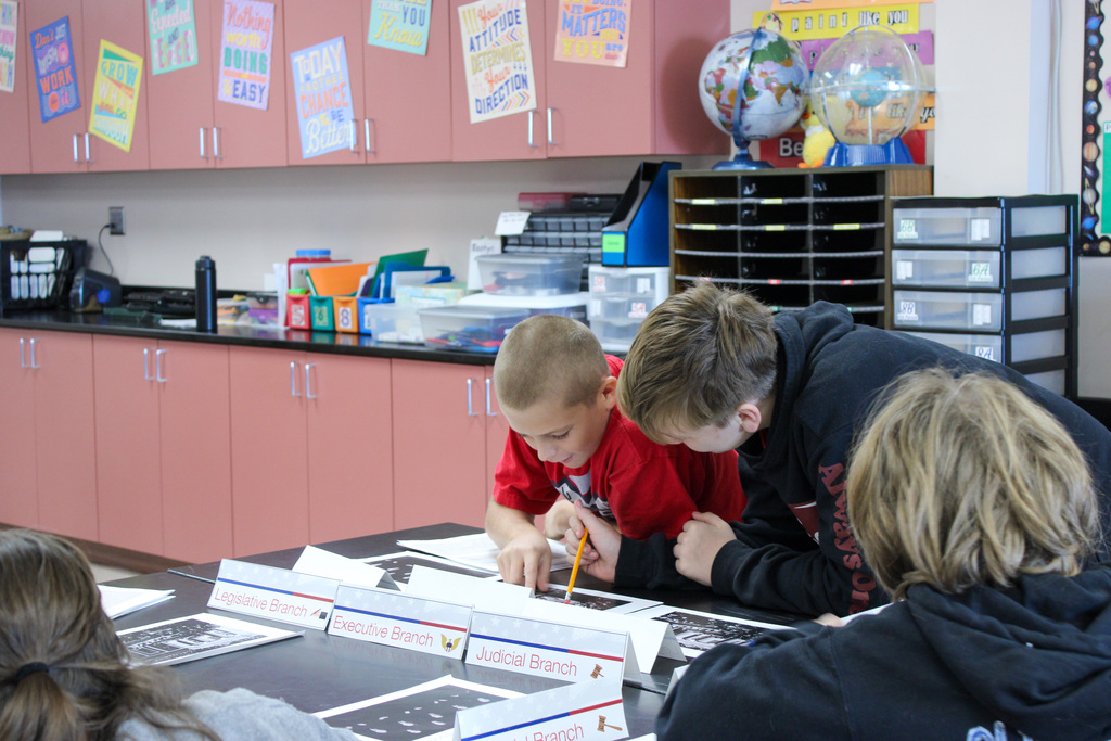 student reviewing Eisenhauer materials during presentation