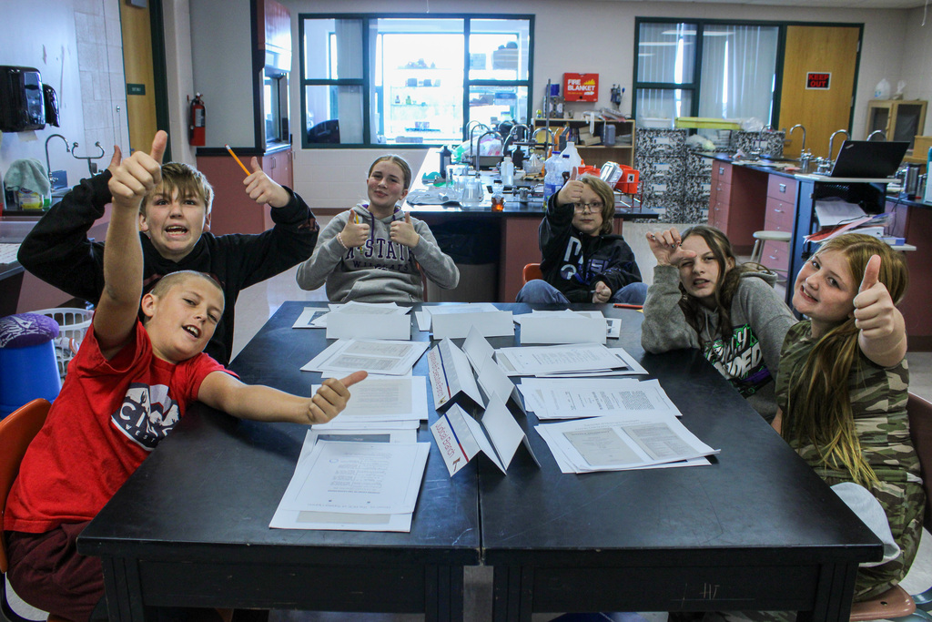 student reviewing Eisenhauer materials during presentation