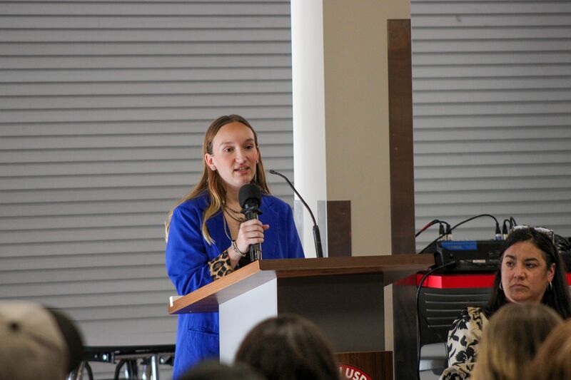 Reanna Dunlap, FFA Sponsor speaking to the guests at induction night