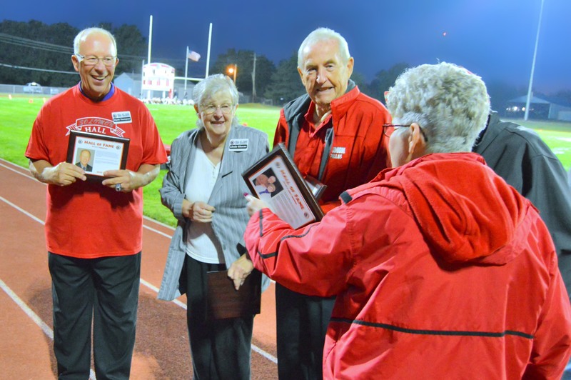 Inductees chatting after ceremony