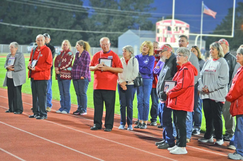 Inductees with families during ceremony