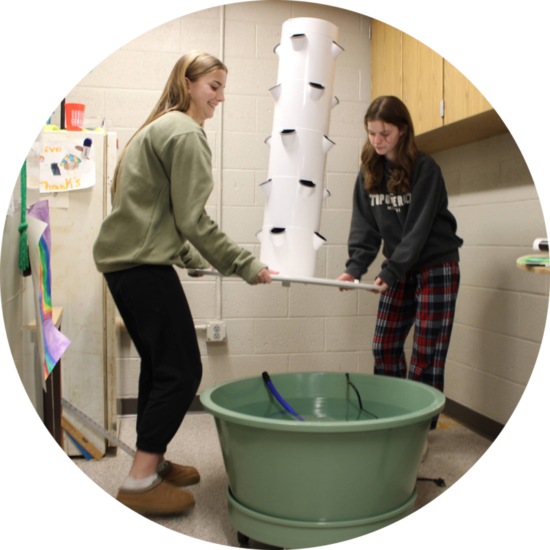 Myah and friend Zoey setting up unit