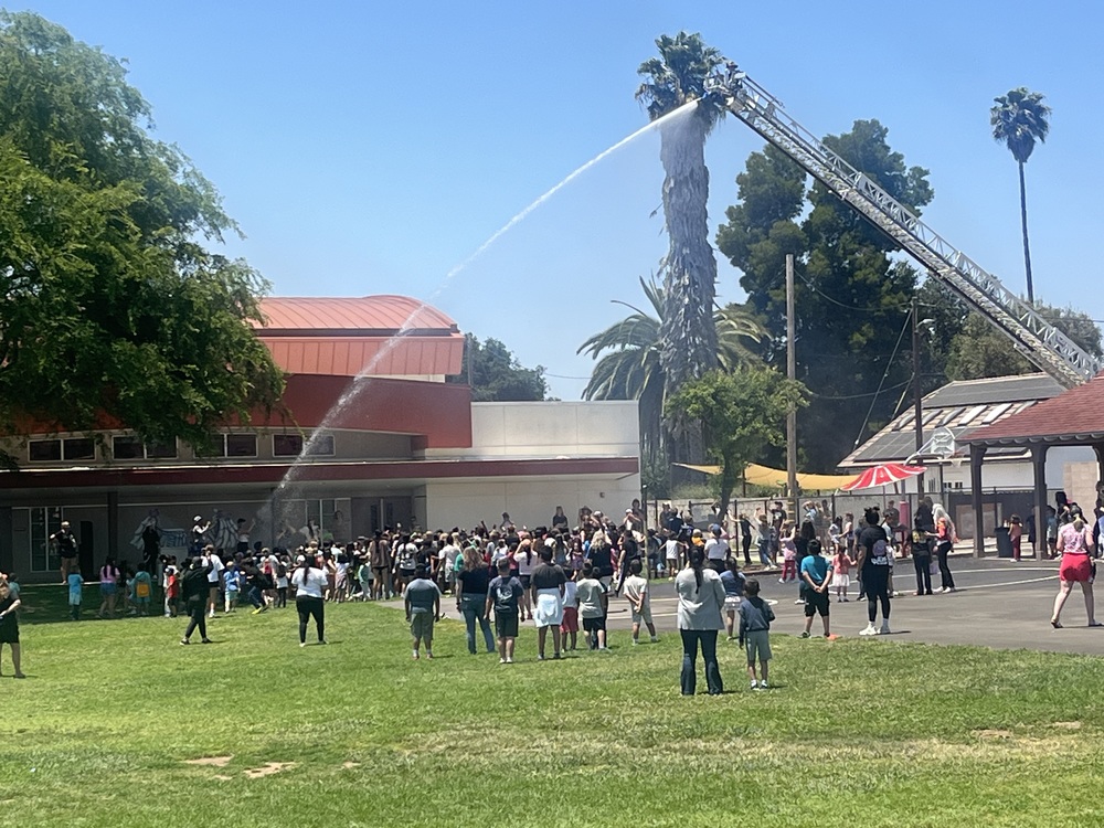 Fire department sprays students during Field Day