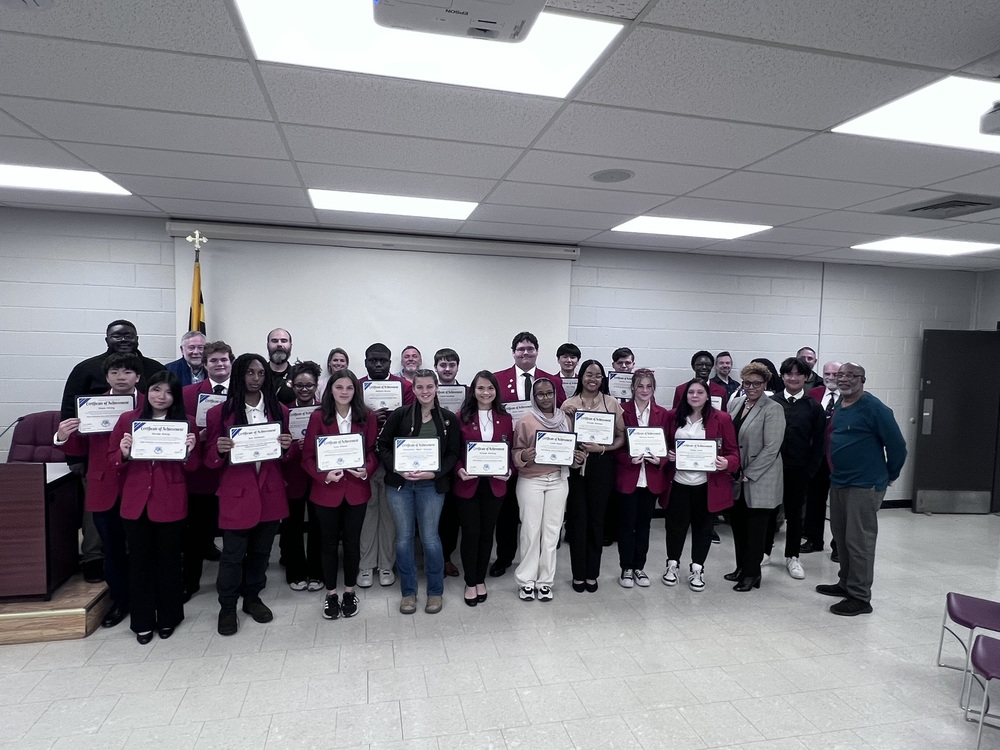 group of students gathered holding certificates in the board room of the Somerset BOE