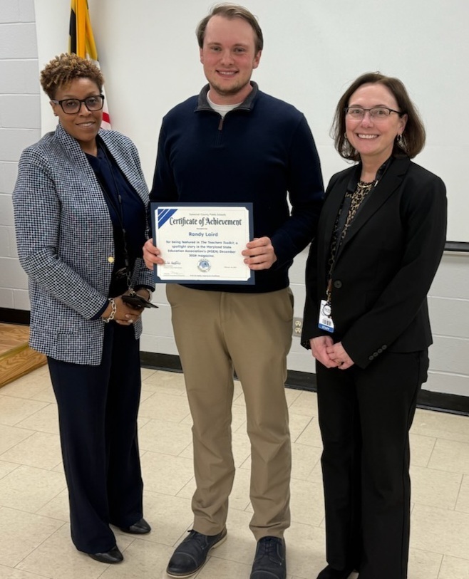 Mr. Laird picture with Social Studies Supervisor Mrs. Holland, and Dr. Tasker-Mitchell