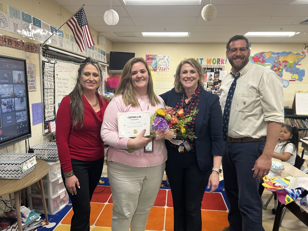 Teacher posing with admin for Teacher of the Year award