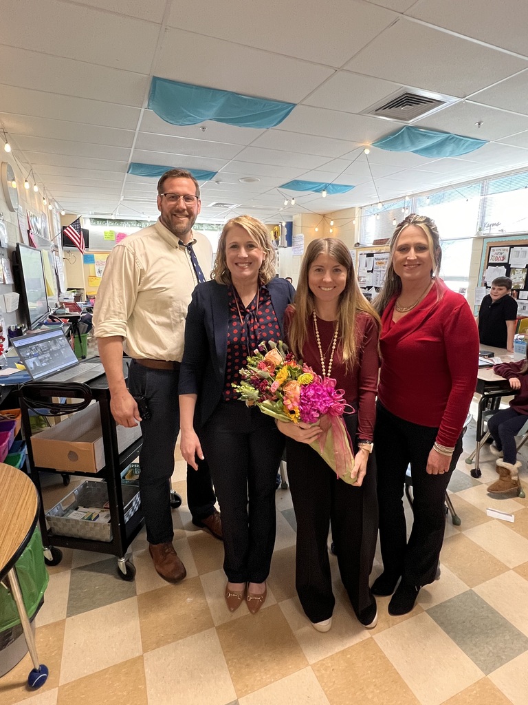 Teacher posing with admin for Teacher of the Year award