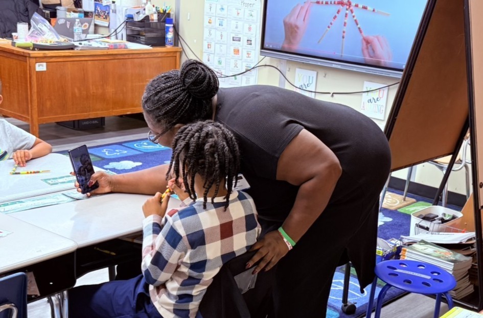 parents participating in a lesson in a classroom at Princess Anne Elementary School for American Education Week 2025