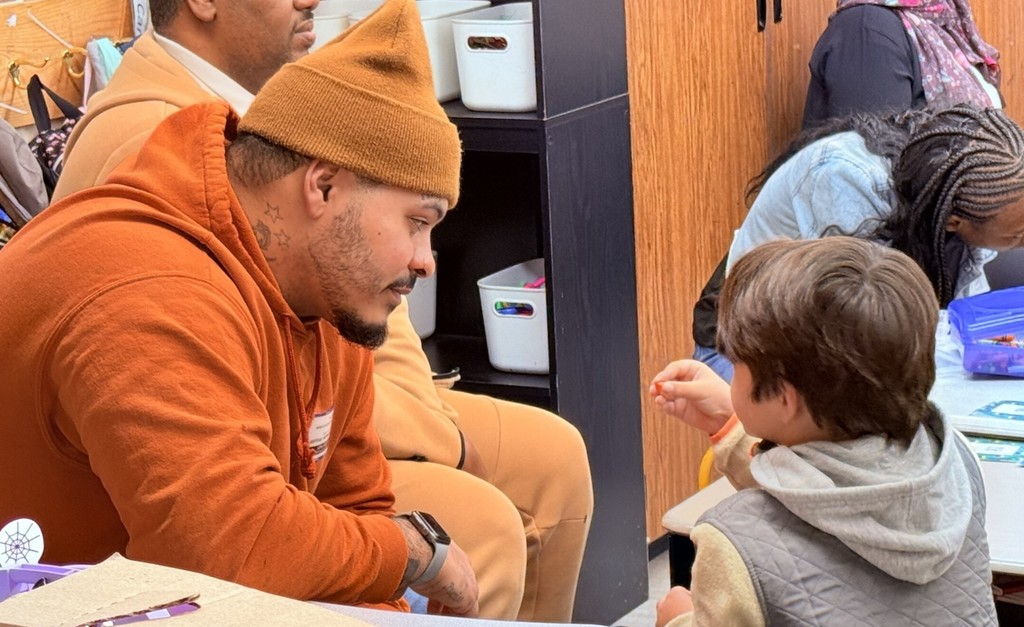 parents participating in a lesson in a classroom at Princess Anne Elementary School for American Education Week 2025