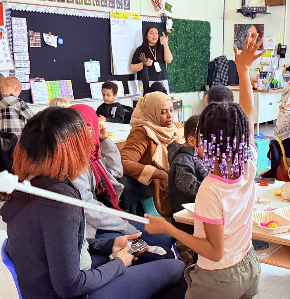 parents participating in a lesson in a classroom at Princess Anne Elementary School for American Education Week 2025