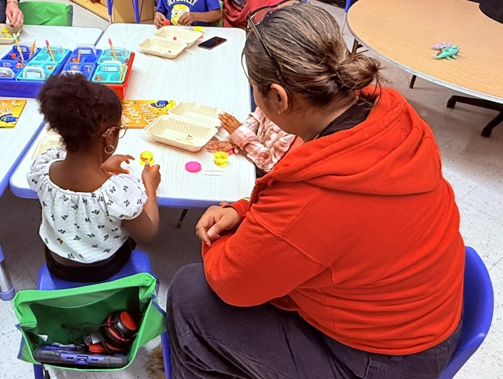 parents participating in a lesson in a classroom at Princess Anne Elementary School for American Education Week 2025