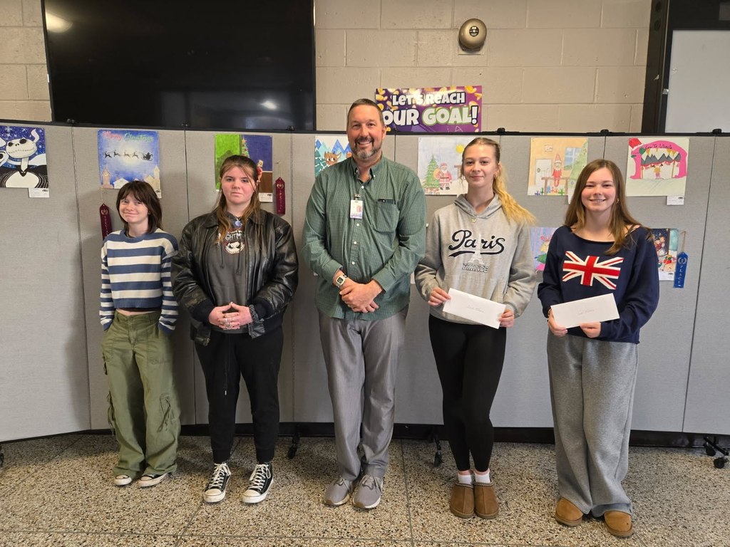Mr. Simpson and winners Sophie Mister and Bella McHenry (right)