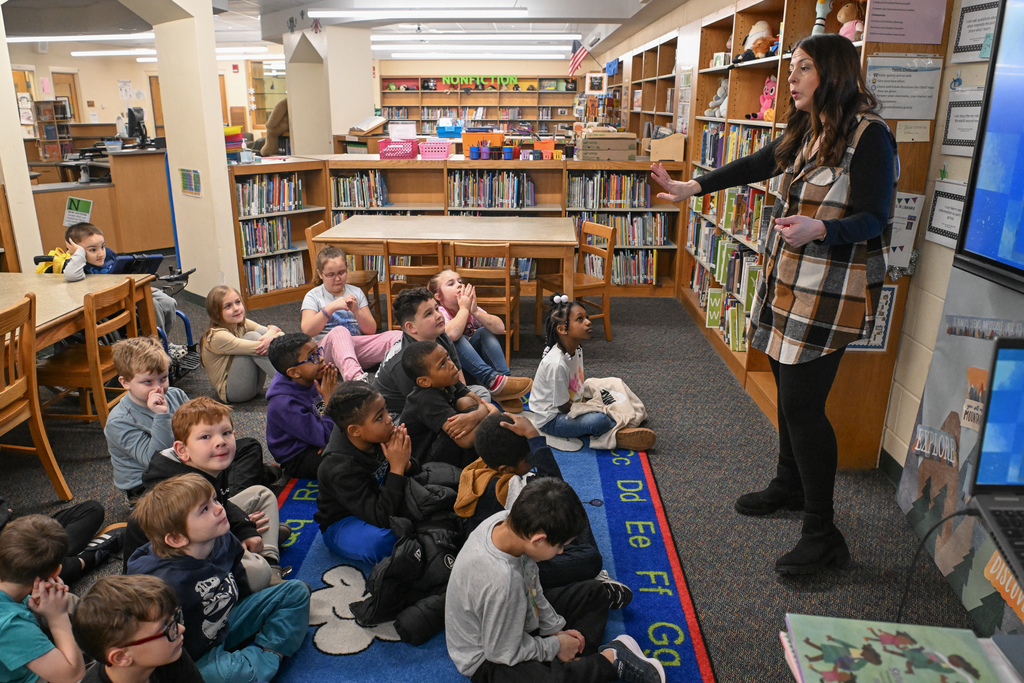 Images of Carter G. Woodson's 26-27 Teacher of the Year and classroom of Corey Bivens, Media Specialist.