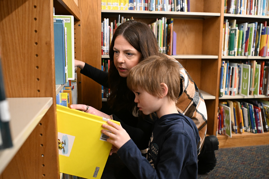 Images of Carter G. Woodson's 26-27 Teacher of the Year and classroom of Corey Bivens, Media Specialist.